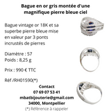 Bague or gris 750 montée d'une magnifique pierre bleue ciel